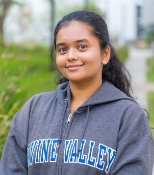 smiling young woman in IVC sweatshirt